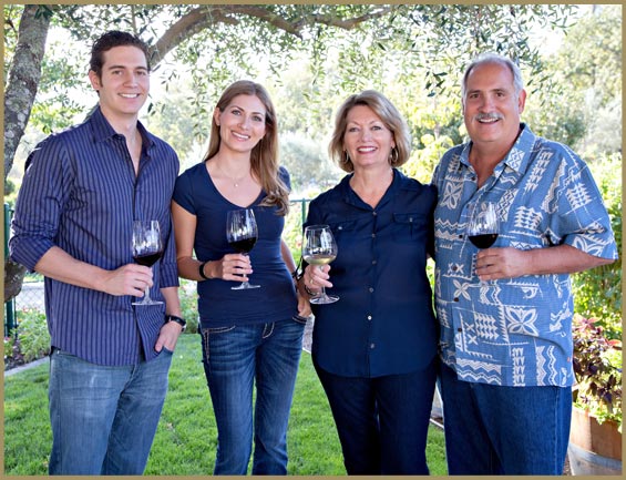 Family at winery with glasses of wine